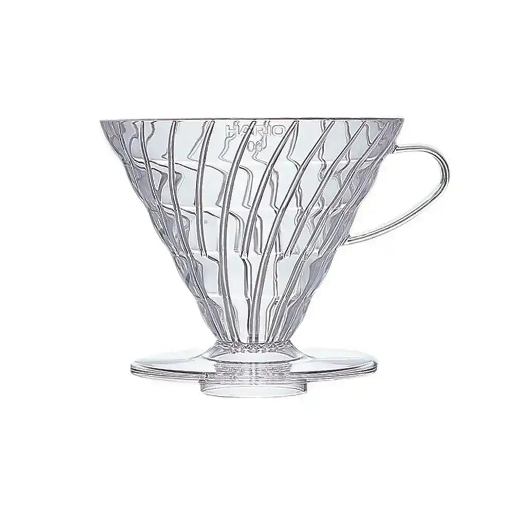 Clear glass coffee filter with decorative design on a white background