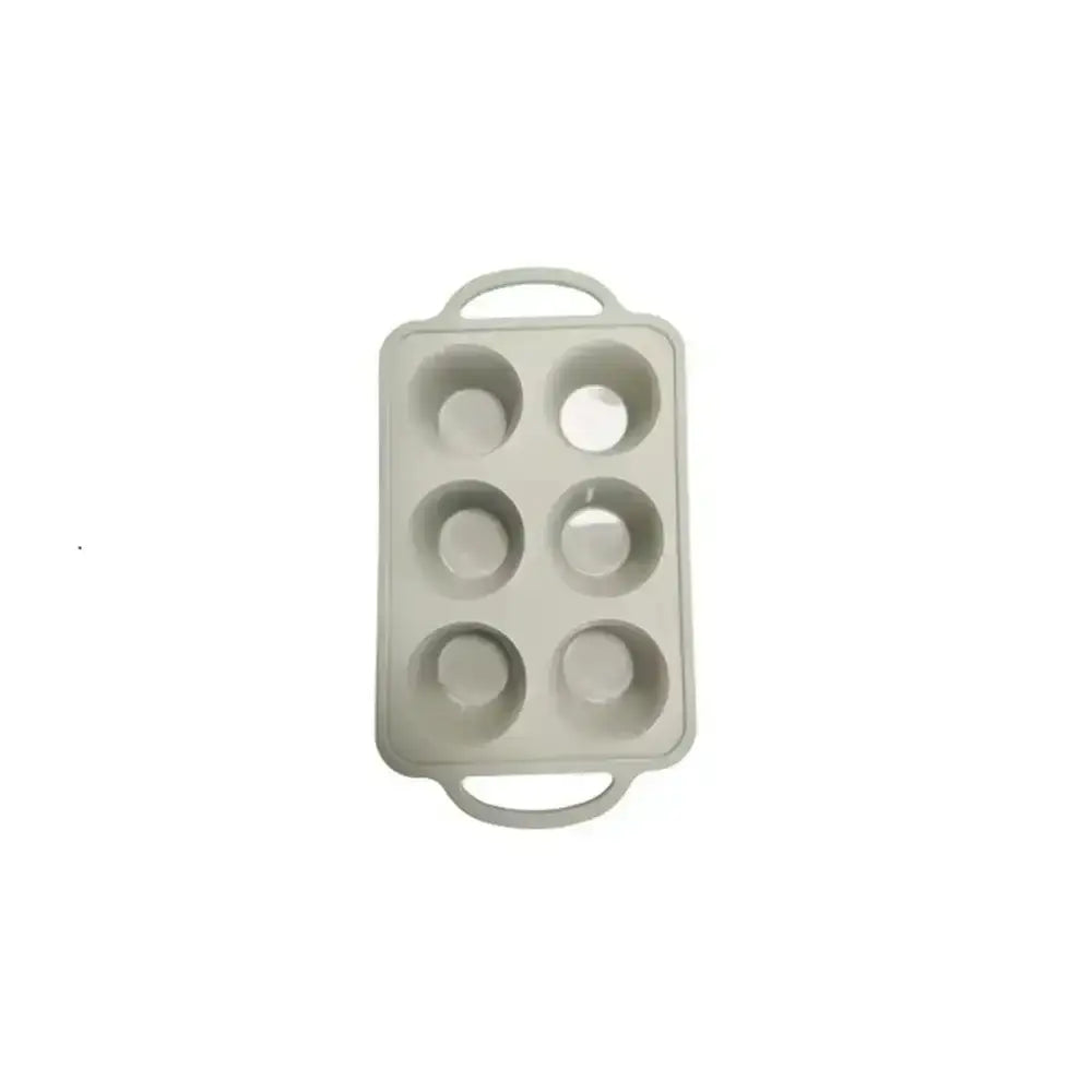 Gray silicone mold with six round cavities on a white background