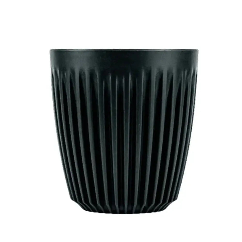 Black ribbed coffee cup on a white background