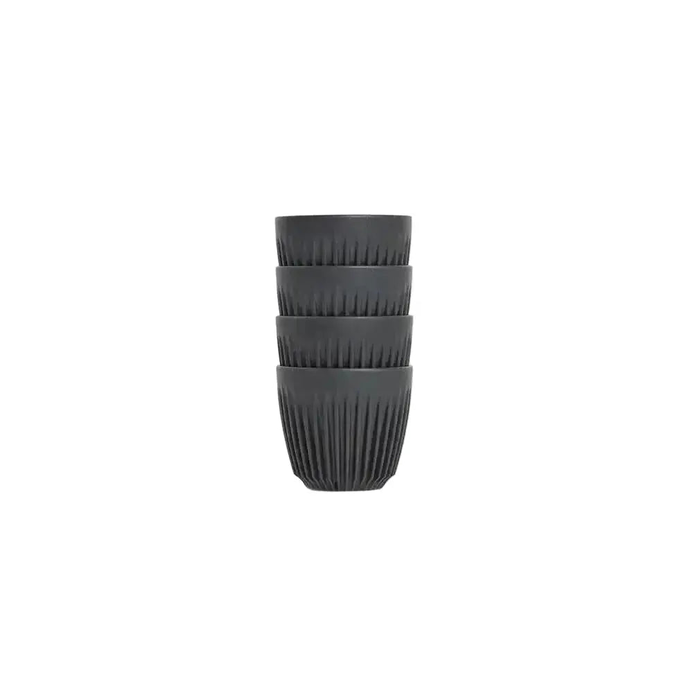 Stack of black ceramic cups on a white background