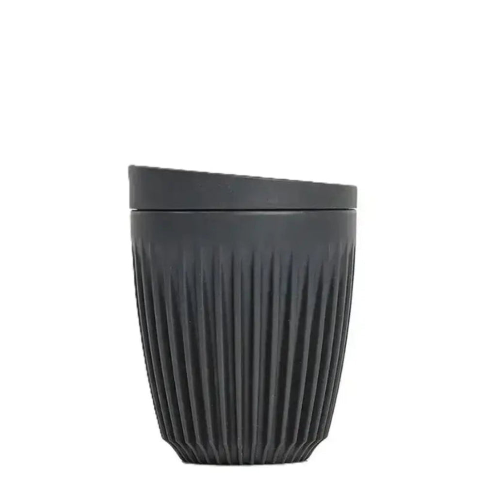 Black ribbed cup on a white background