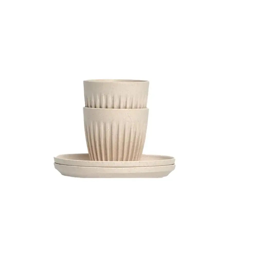 Set of beige ceramic bowls on a white background