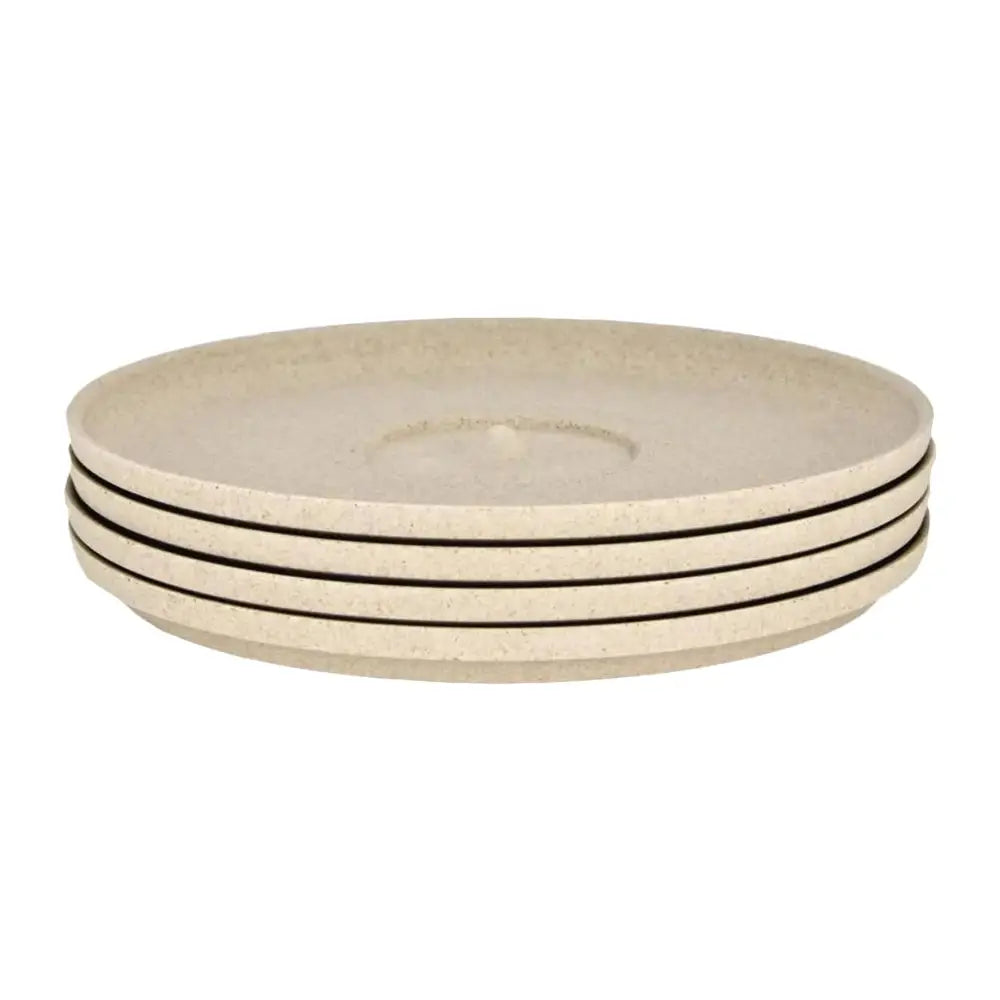 Set of four beige saucers on a white background