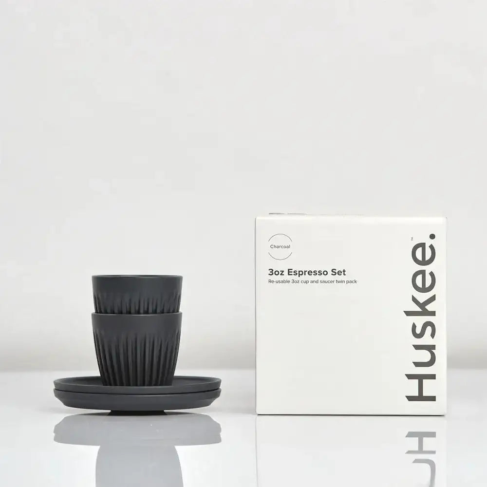 Black espresso set with matching box on a white background