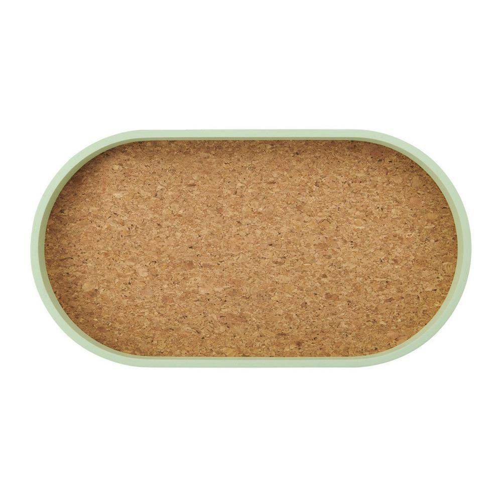 Cork tray with a green rim on a white background