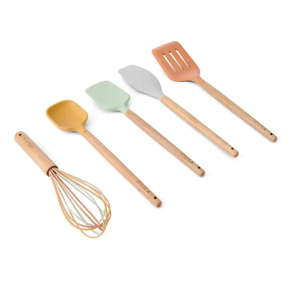 Set of five silicone and wood kitchen utensils including spatula, spoon, and whisk on white background.