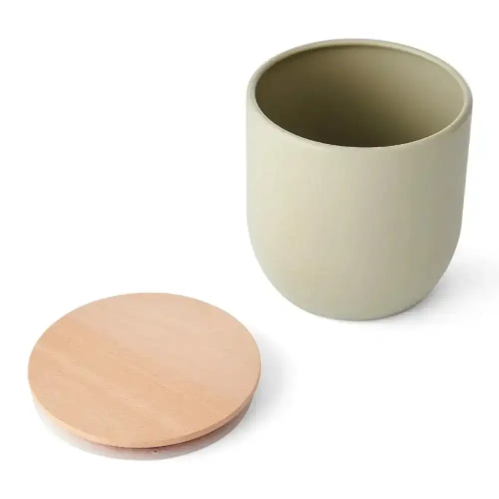 Storage Jar with a wooden lid on a white background