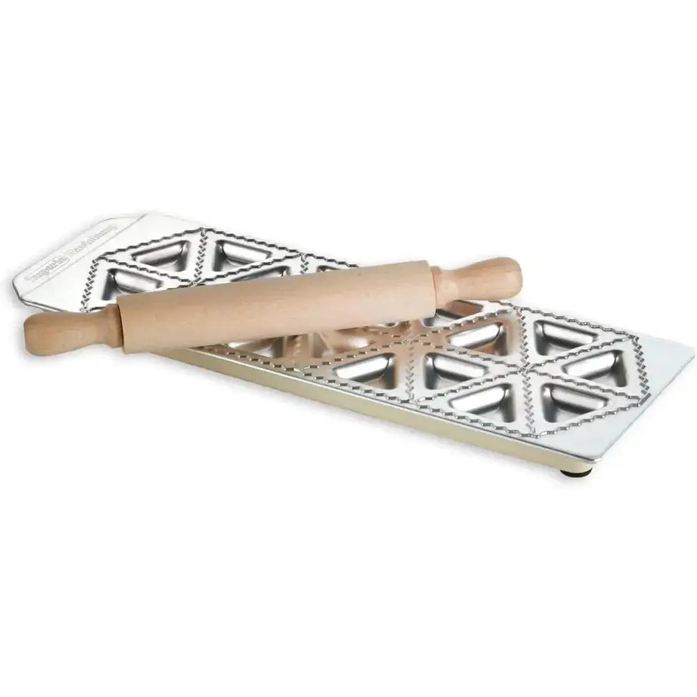 Metal ravioli mould with wooden rolling pin on a white background
