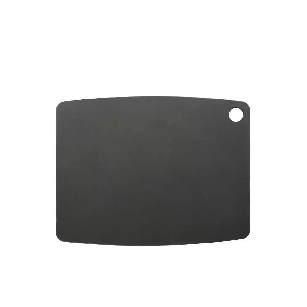 Black cutting board with a round hole on a white background