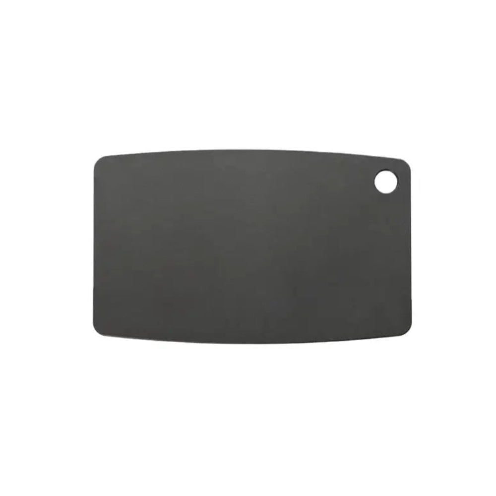 Black cutting board with a round hole on a white background