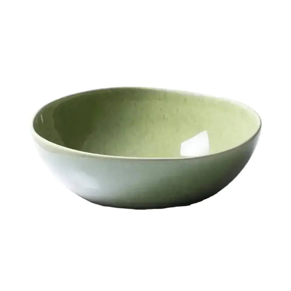 Green ceramic bowl on a white background