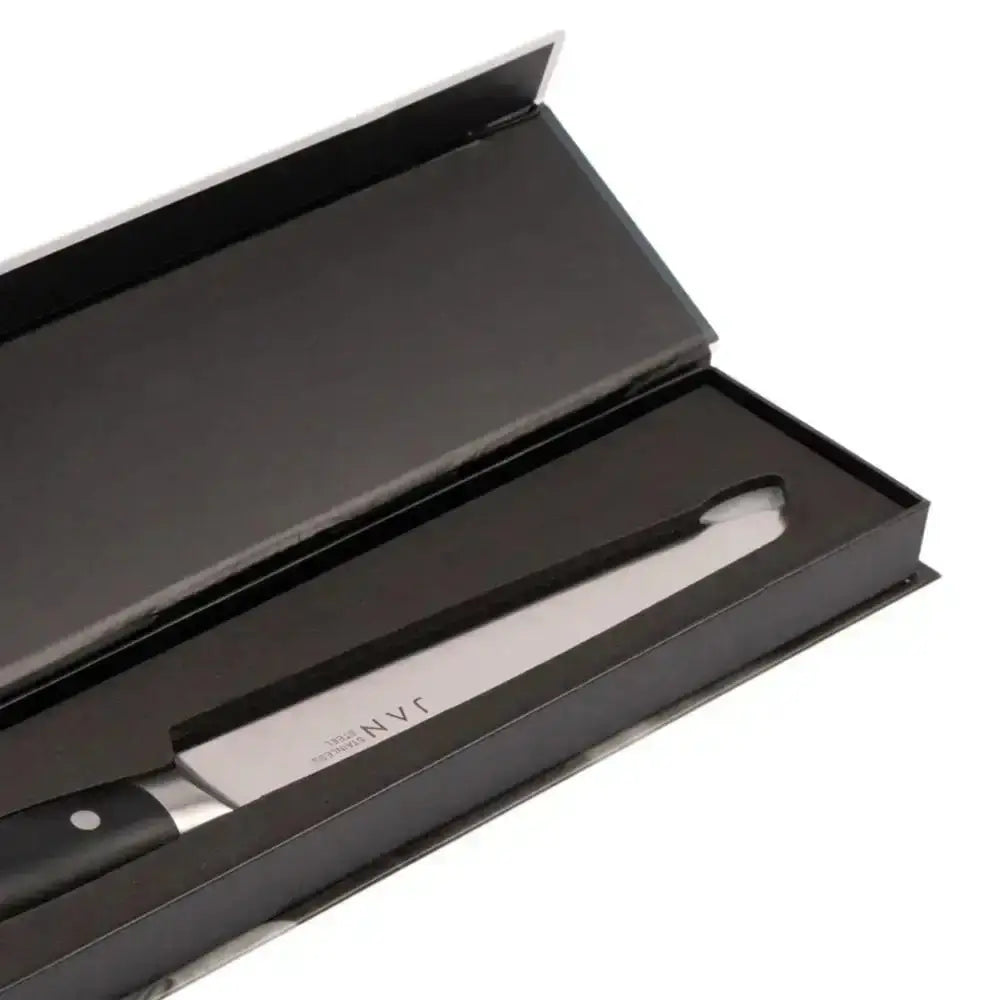 Knife with black handle and silver blade in a black box on a white background