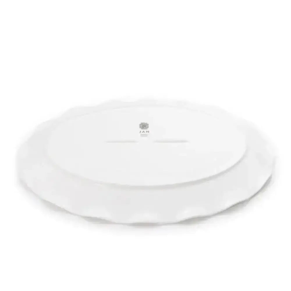 White ceramic plate with a brand logo on a white background