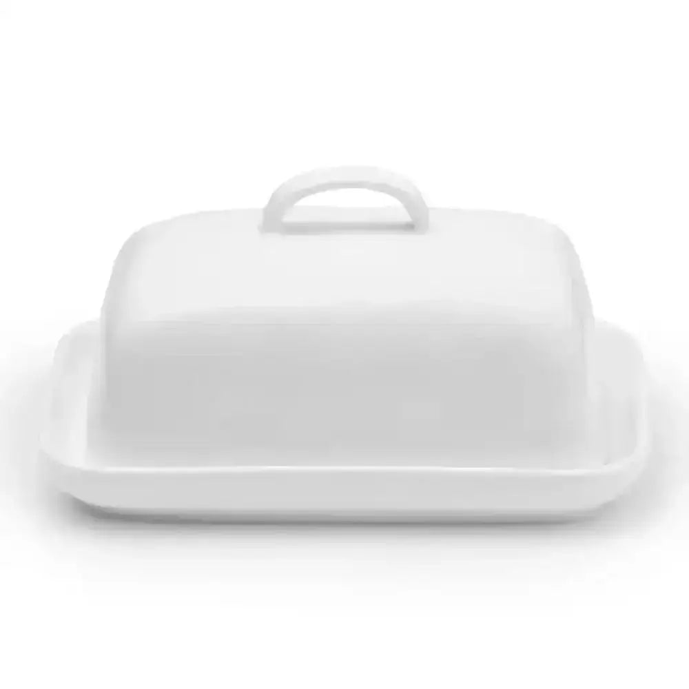 White ceramic butter dish with lid on a white background