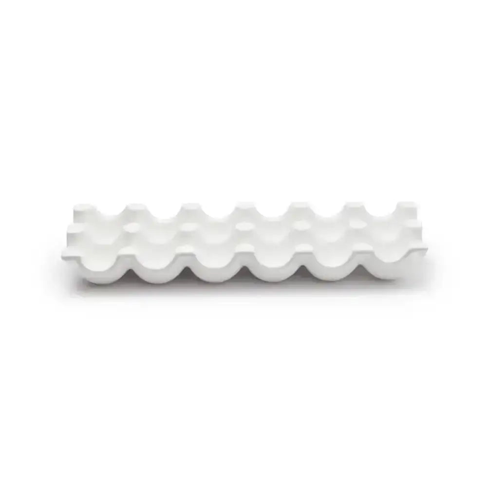 White wavy ceramic plate on a white background