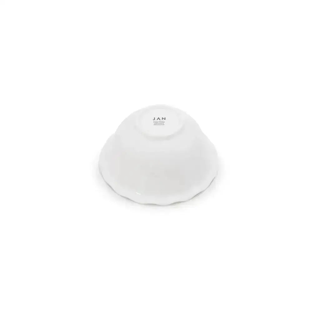 White nibble bowl with 'JAN' branding on a white background