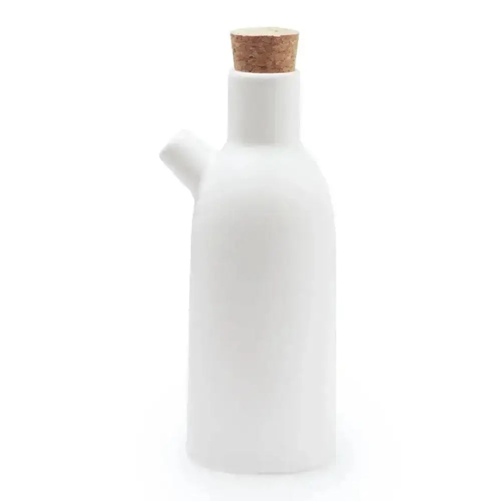 White ceramic oil bottle with a cork lid on a white background
