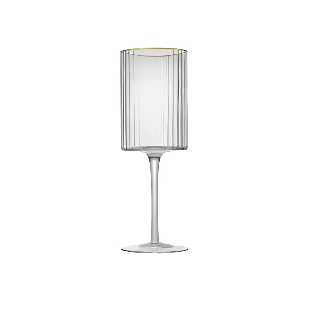 Clear glass wine glass with gold rim on a white background