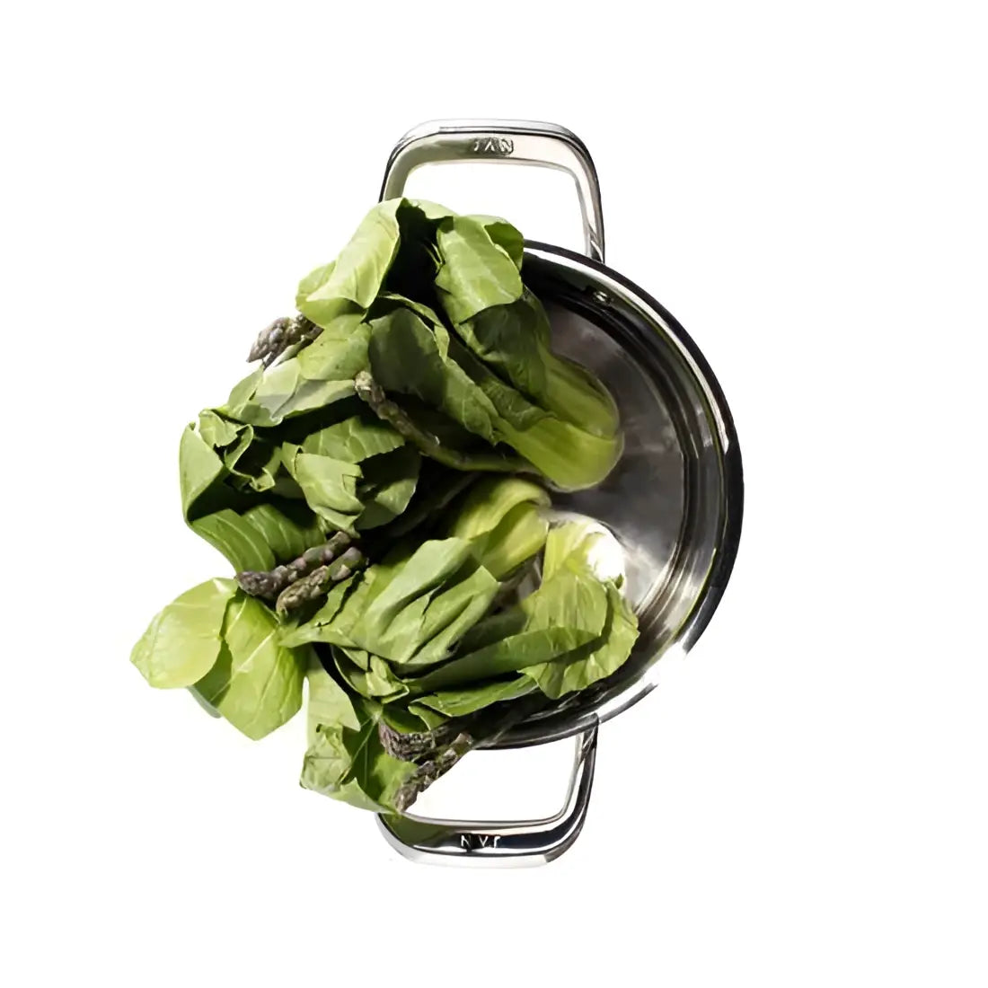 Metal strainer with green leafy vegetables on a white background