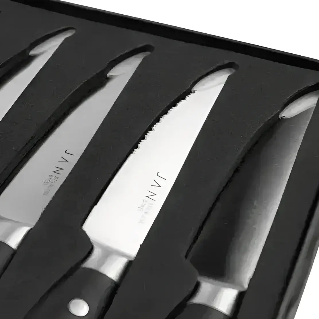 Set of steak knives with black handles in a black box