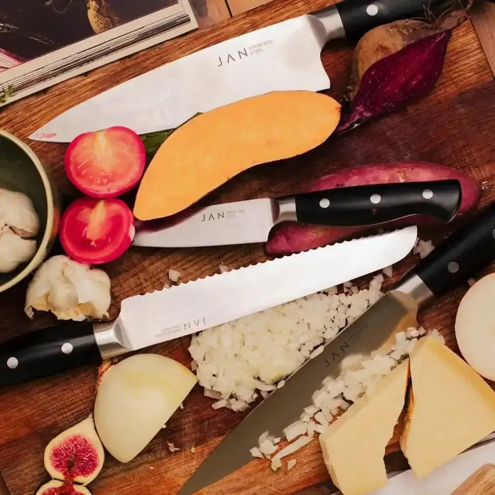 Knives on a cutting board with chopped vegetables and ingredients