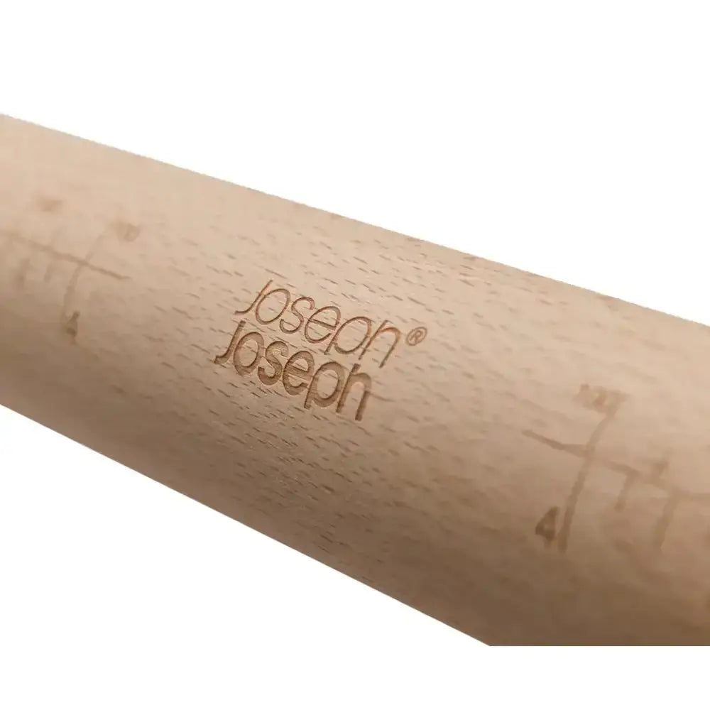 Wooden rolling pin with measurement markings and 'Joseph Joseph' branding on a white background