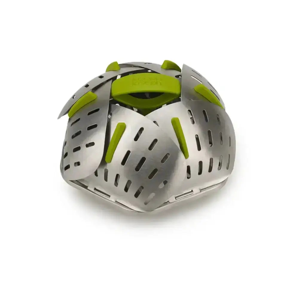 Metallic kitchen tool with green accents on a white background