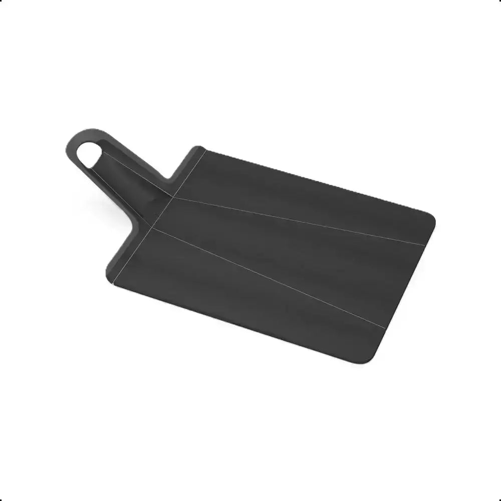 Black plastic cutting board on a white background
