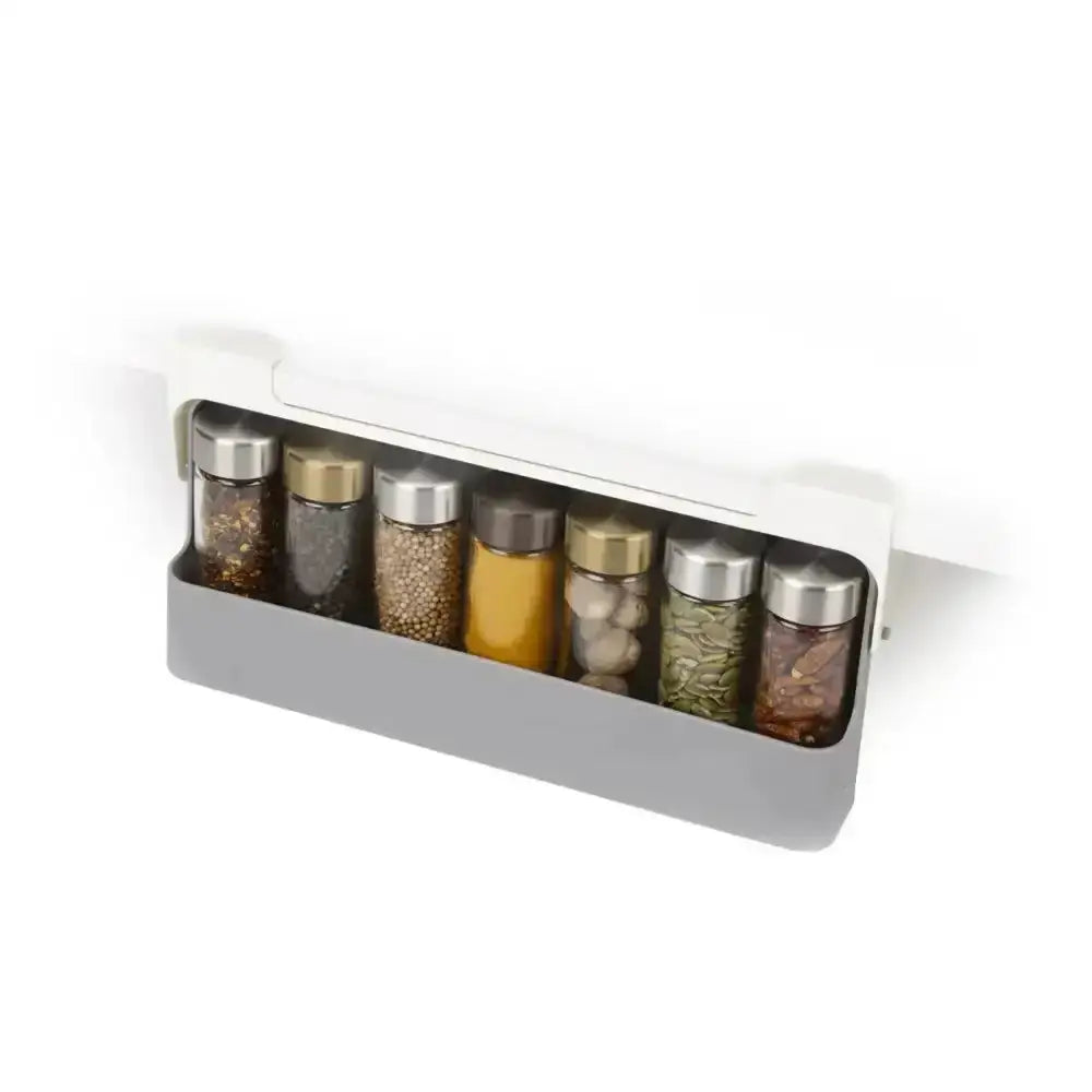 Spice rack with various spice containers on a white background