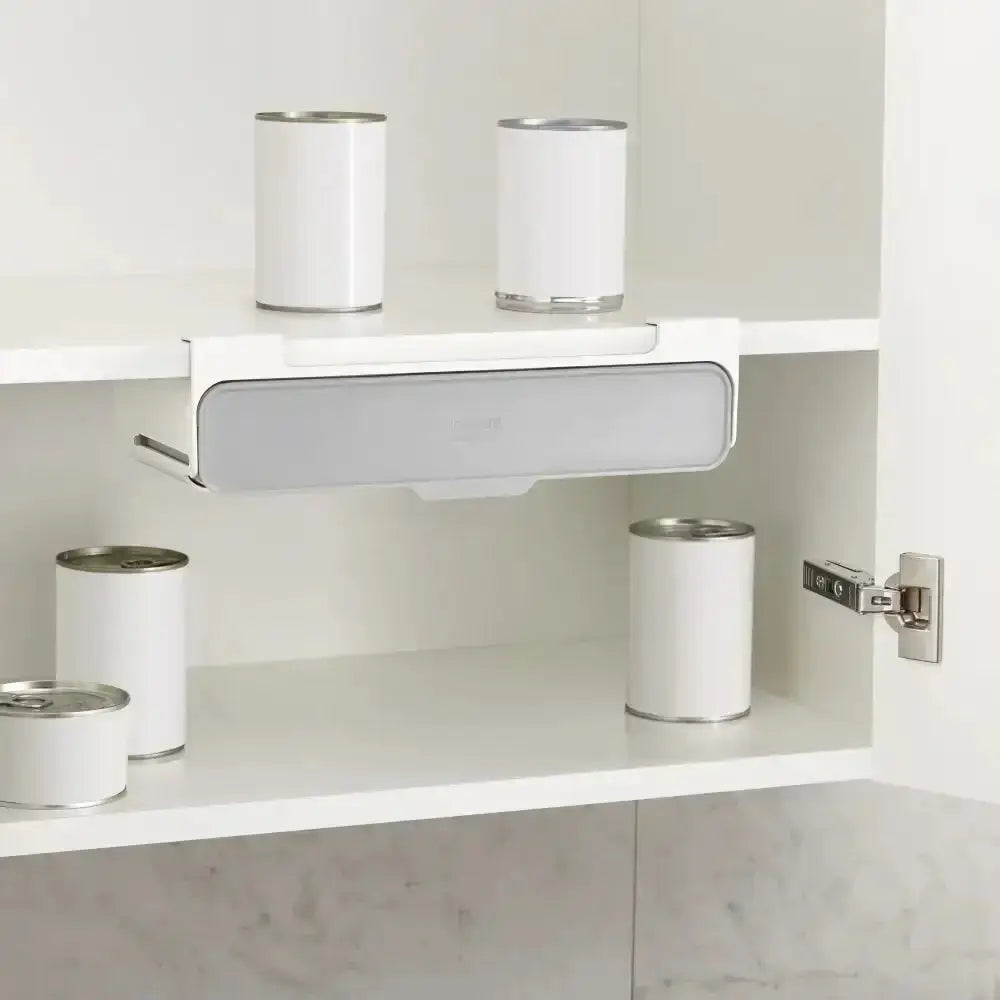 White shelves with cans inside a cabinet