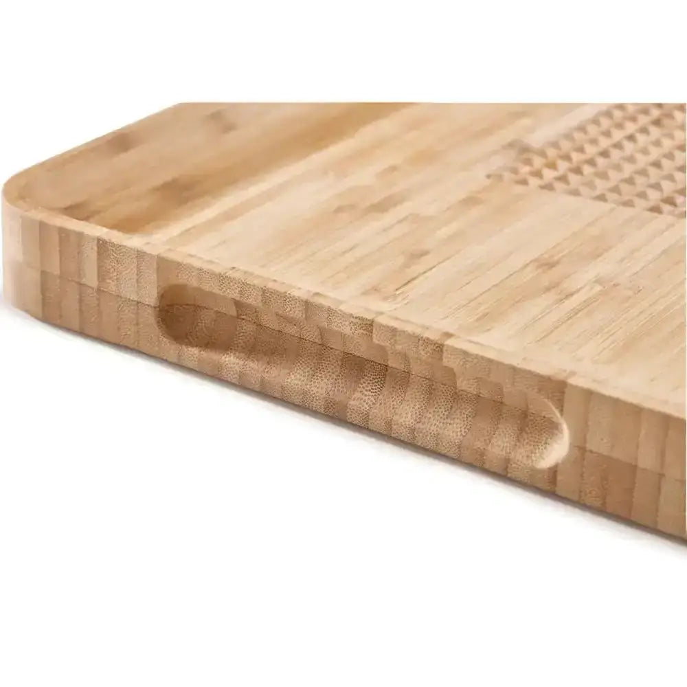 Close-up of a wooden cutting board with a white background