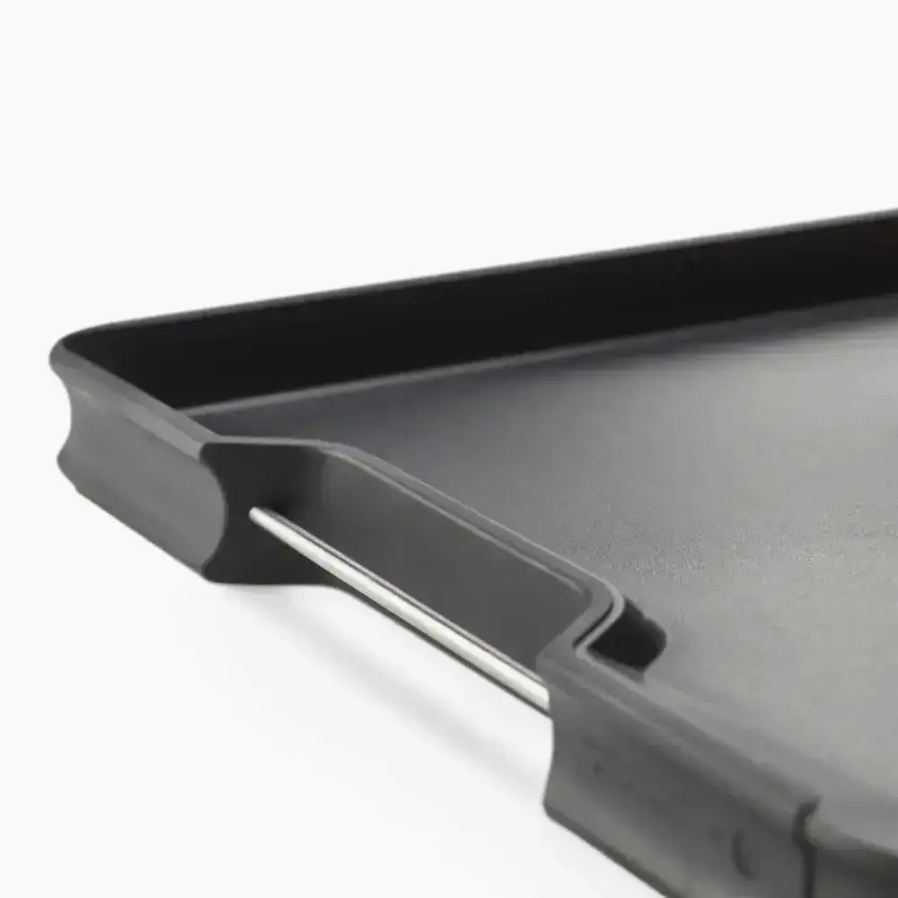 Black griddle pan on a white background