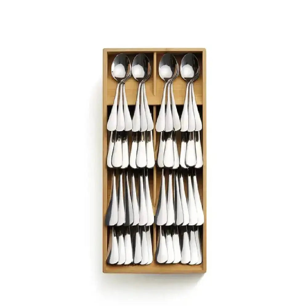 Set of silver spoons in a wooden box on a white background