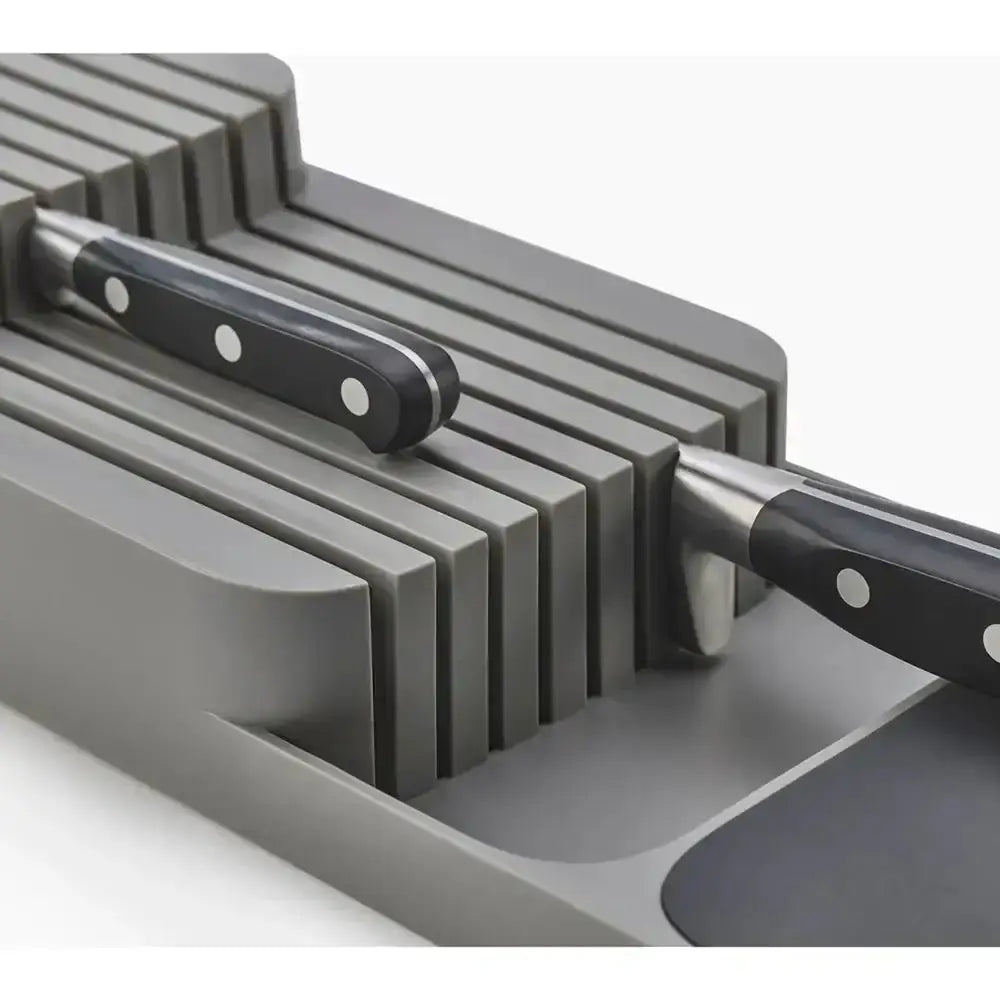Knife set with a gray knife block on a white background