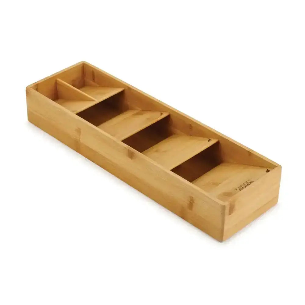 Wooden tray with compartments on a white background
