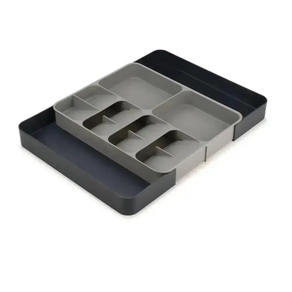 Gray plastic tray with compartments on a white background