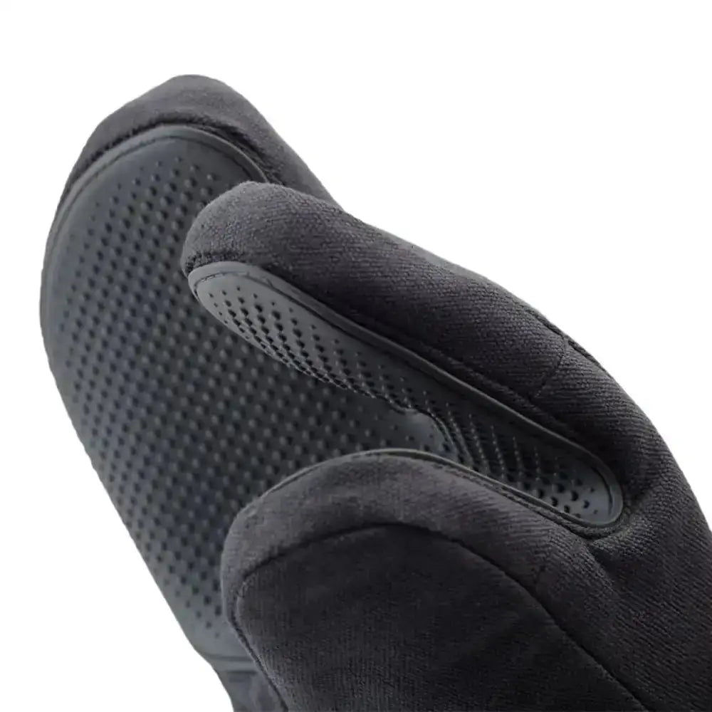 Close-up of a black oven glove with textured palm and fingers on a white background