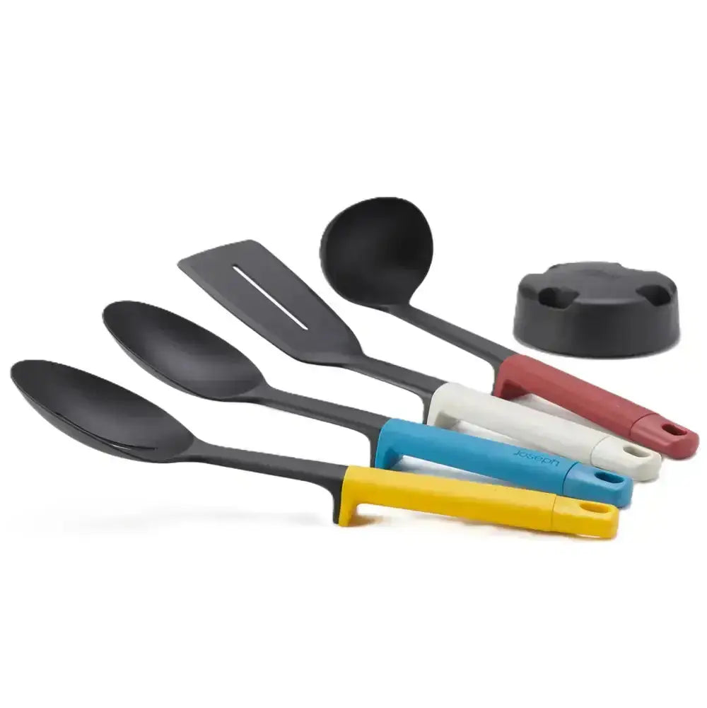 Set of kitchen utensils with colorful handles on a white background