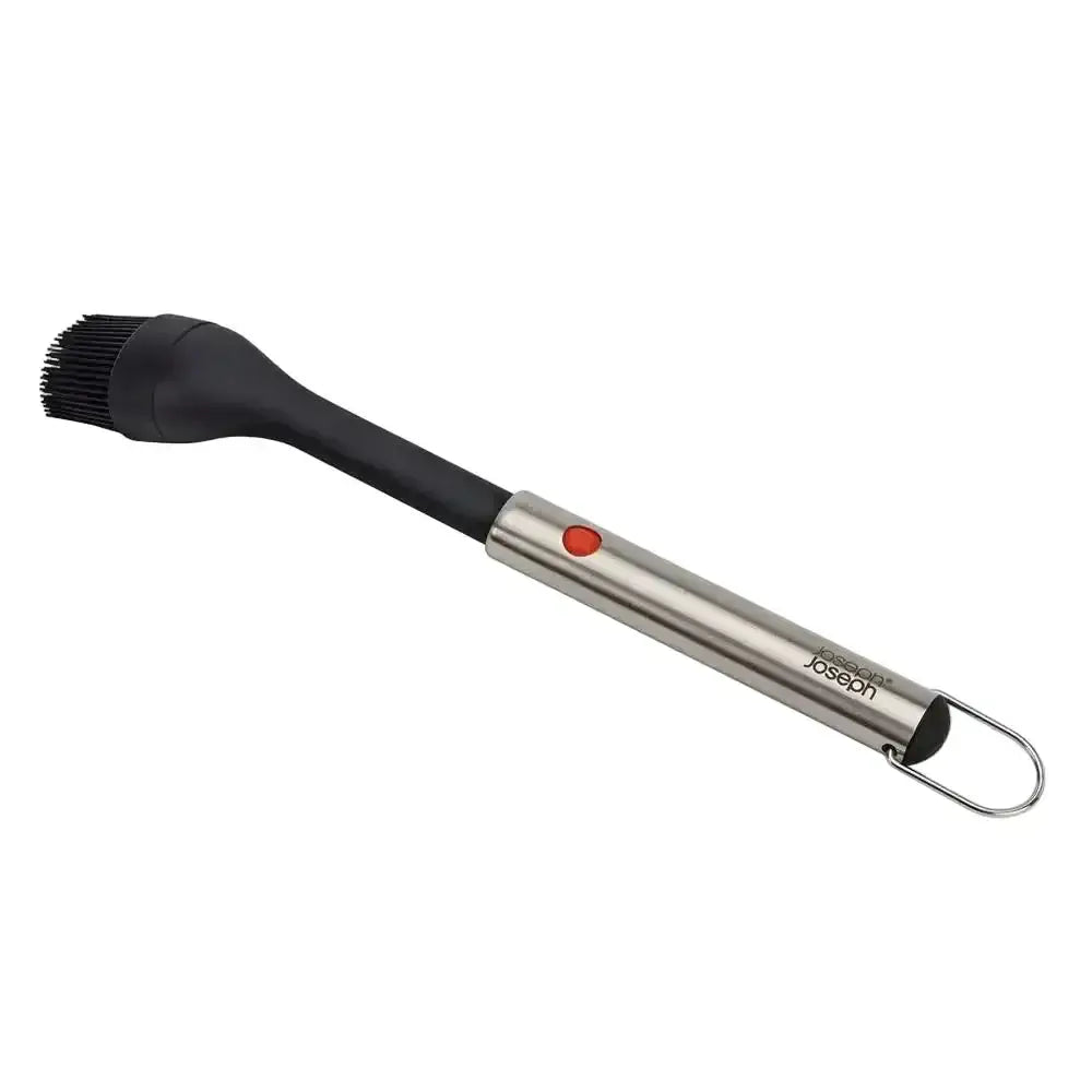Barbecue brush with black bristle head and stainless steel handle on a white background