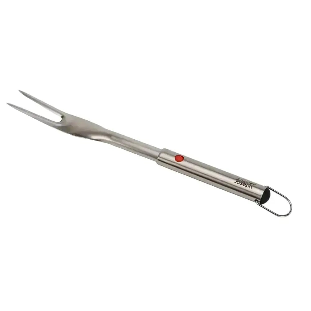 Stainless steel grill fork with red button on a white background