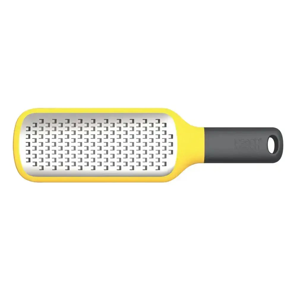 Yellow and black handheld grater on a white background