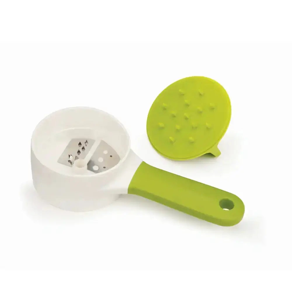 White and green kitchen tool with a handle and detachable component on a white background
