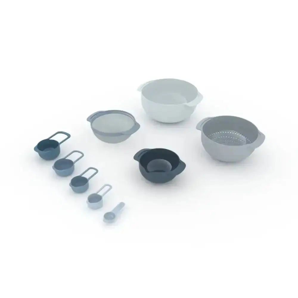 Set of kitchen utensils including bowls, measuring cups, and spoons on a white background