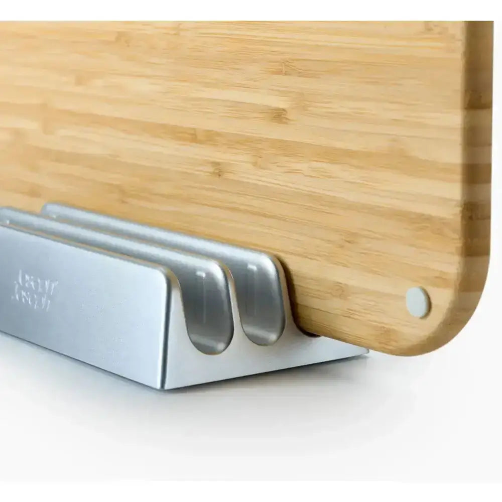 Wooden cutting board with a metal stand on a white background