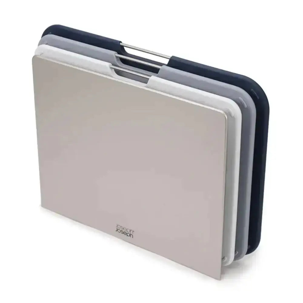 Set of three cutting boards in beige, white, and navy on a white background