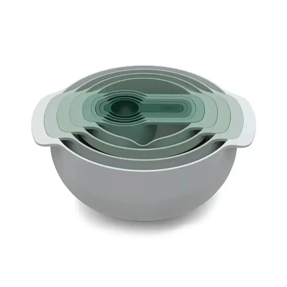 Set of green and gray nesting bowls with lids on a white background
