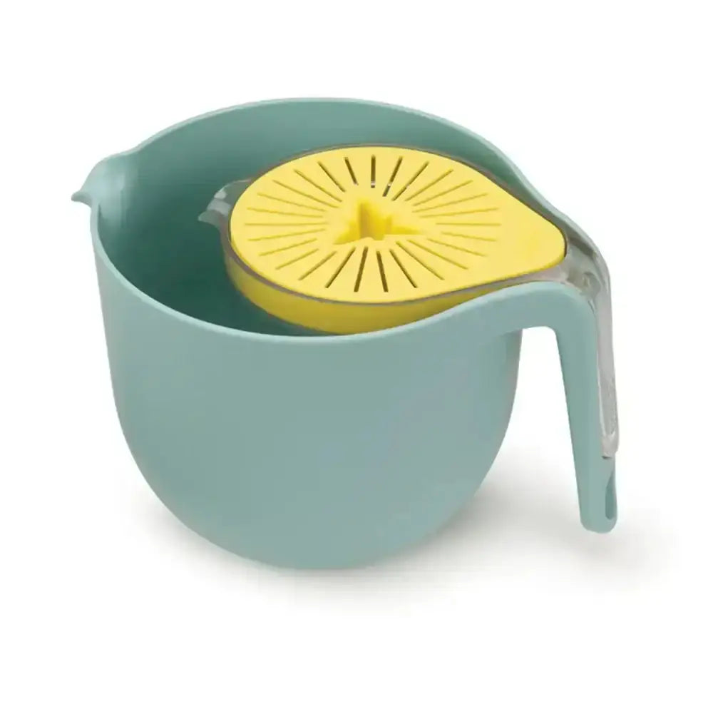 Green and yellow citrus juicer on a white background
