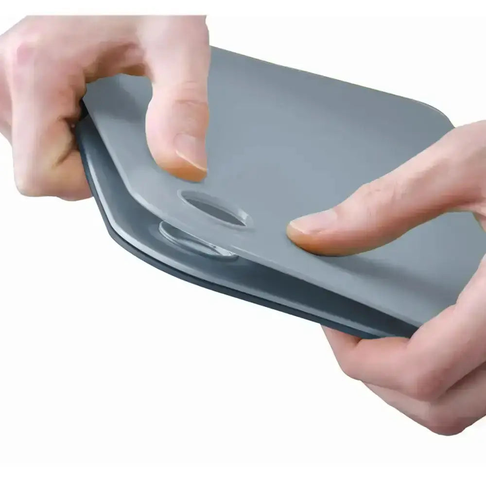 Gray plastic lid held by hands on a white background