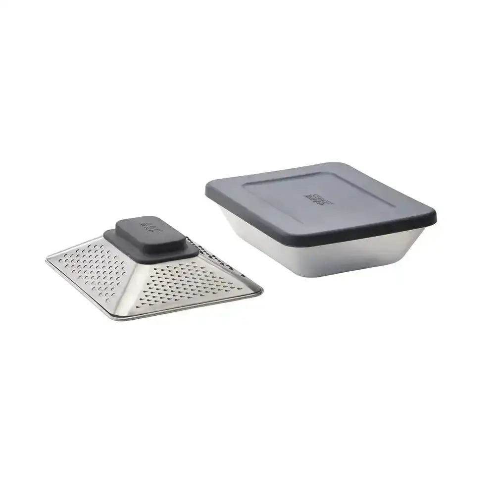 Grater with a black handle and a container on a white background