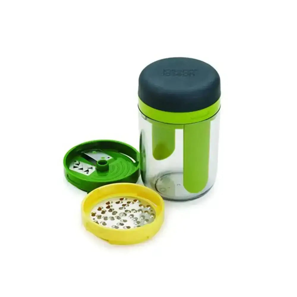 Spice grinder with clear container, green lid, and yellow base on a white background